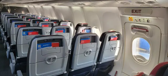 Passenger Reads Her Seatmate's Cruel Texts Mid-Flight — The Fallout Included Free Baileys and a Crushed Bag of Chex Mix
